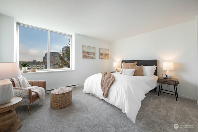 bedroom with baseboard heating and carpet flooring