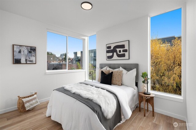 730C Broadway E, Seattle, WA 98102 - bedroom featuring baseboards and wood finished floors