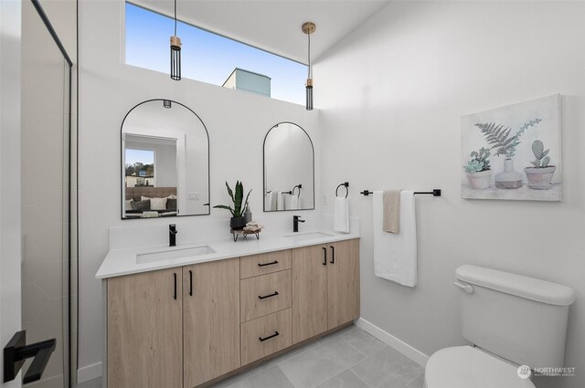 730C Broadway E, Seattle, WA 98102 - full bathroom with plenty of natural light, double vanity, a towering ceiling, and tile patterned floors