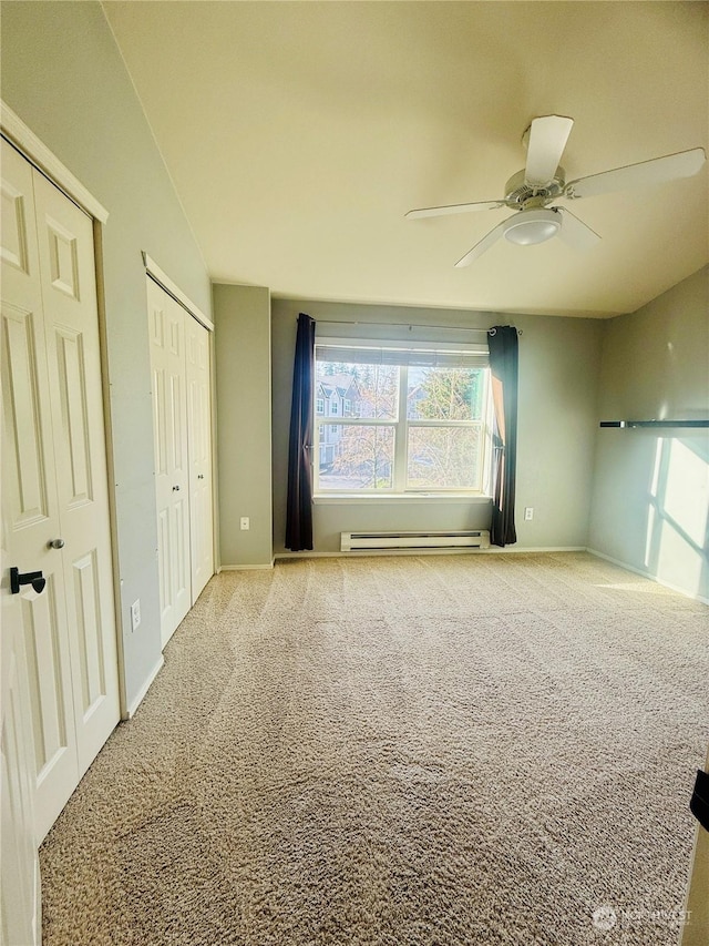 interior space featuring baseboard heating and ceiling fan