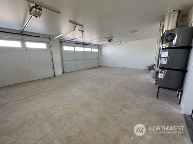 garage with water heater and a garage door opener