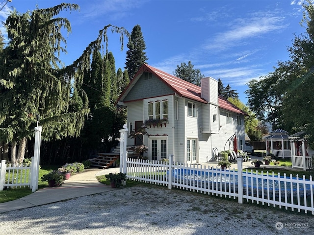 view of front of house featuring a patio and french doors