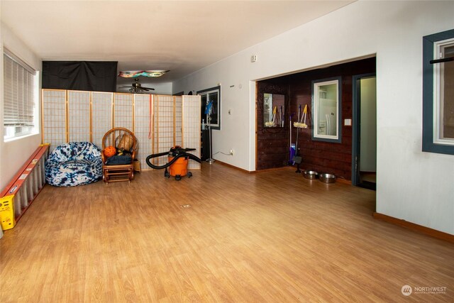 interior space featuring ceiling fan and light wood-type flooring