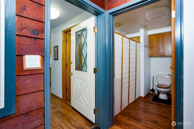 corridor featuring dark wood-type flooring