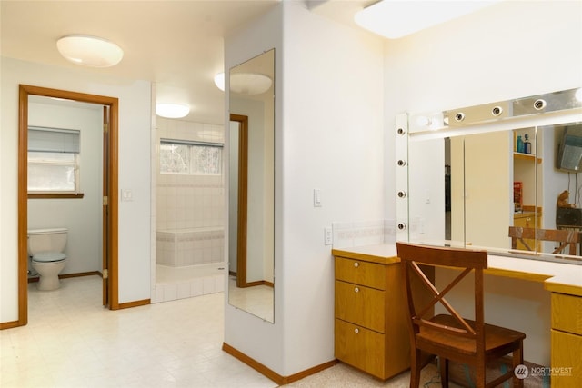 bathroom with vanity and toilet