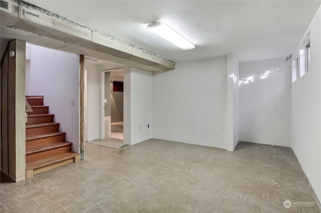 basement featuring light parquet floors