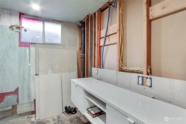 bathroom with concrete flooring