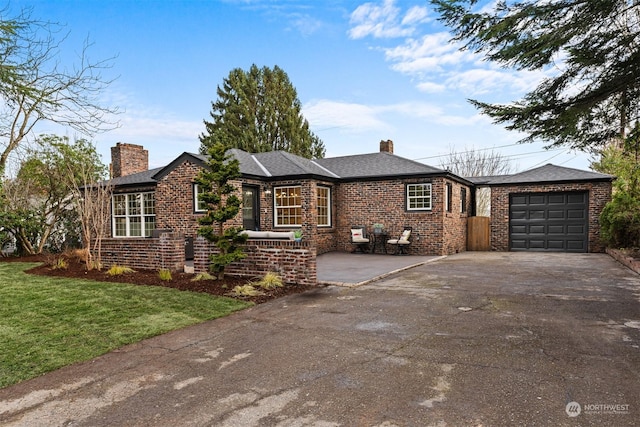 ranch-style home with a front lawn and a garage