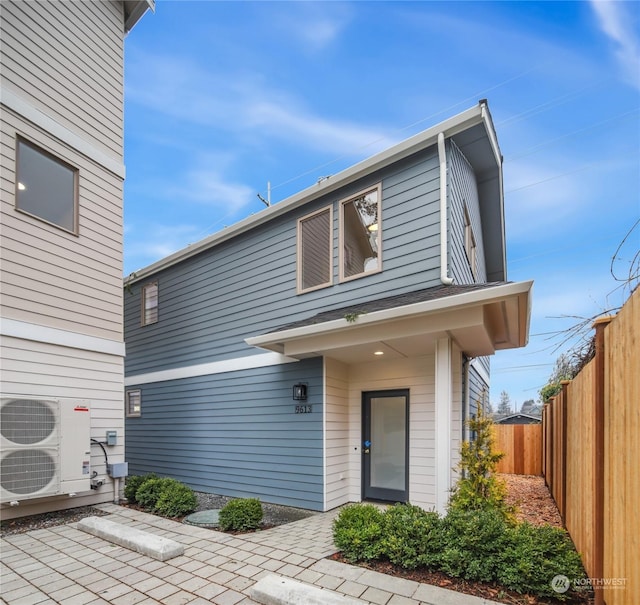 view of front of home with ac unit