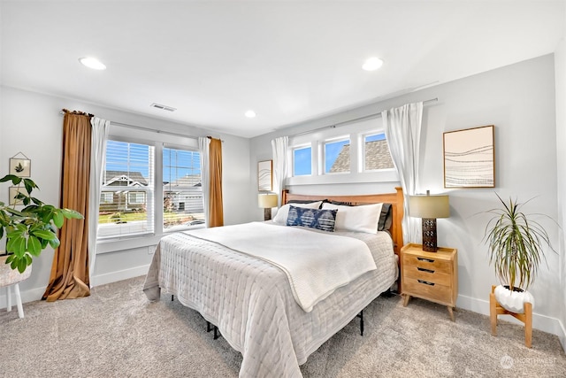 bedroom featuring light colored carpet