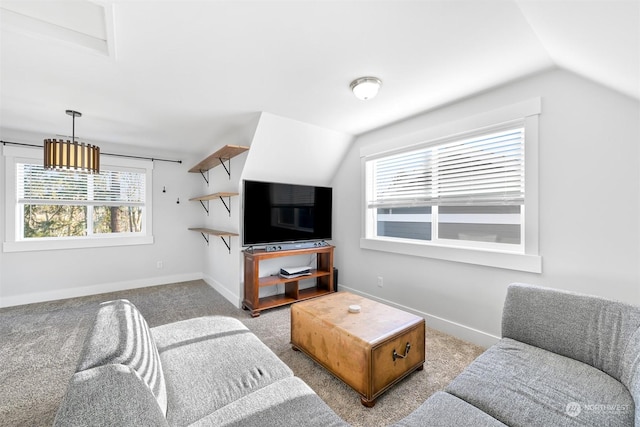 carpeted living room featuring lofted ceiling