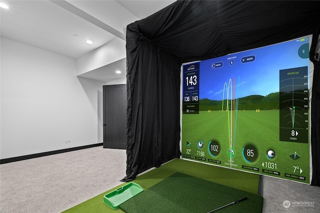 rec room with carpet flooring and golf simulator