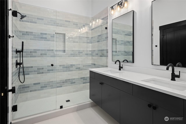 bathroom featuring vanity, tile patterned floors, and a shower with door