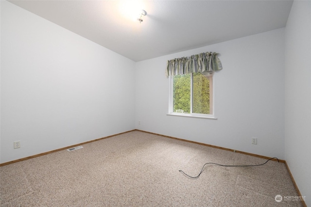 empty room with carpet flooring