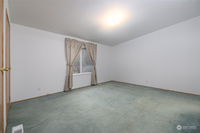 spare room with carpet floors