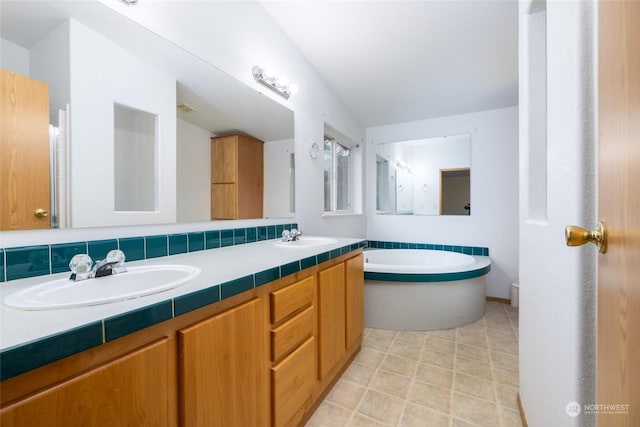 bathroom with vanity, backsplash, and a tub