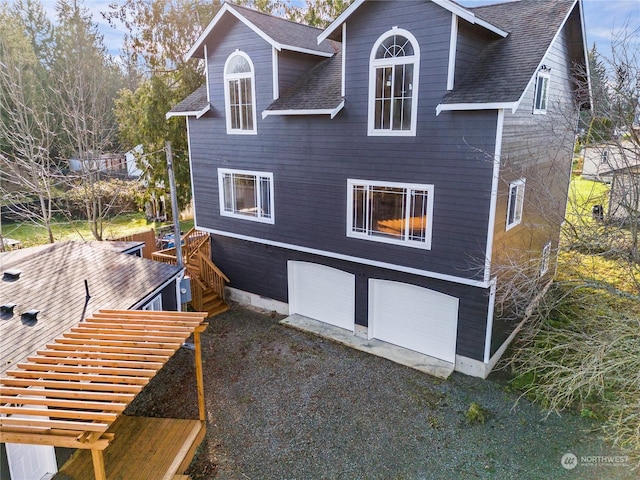 view of side of home with a garage