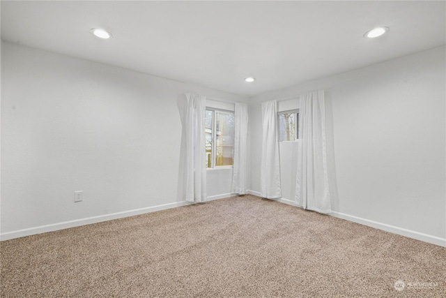 unfurnished room with carpet flooring