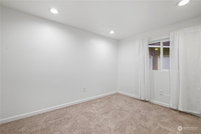 empty room featuring carpet flooring