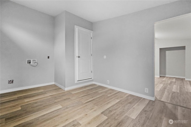 unfurnished room with light hardwood / wood-style floors