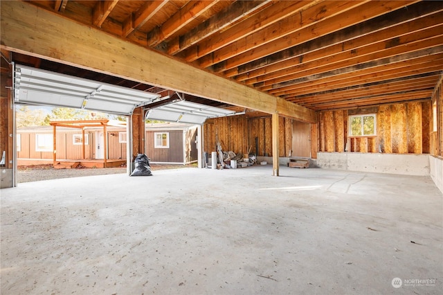 misc room with a wealth of natural light and concrete floors