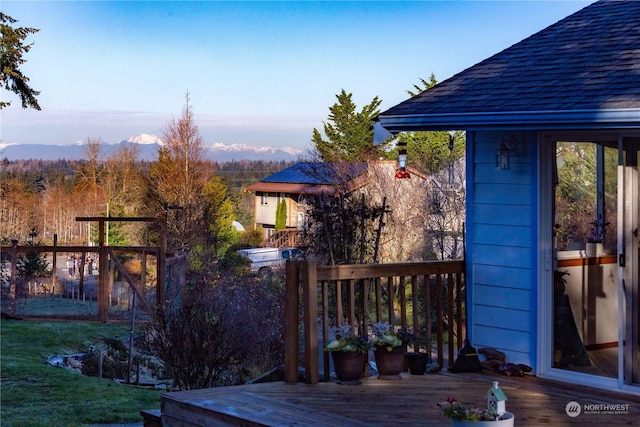 wooden deck with a mountain view