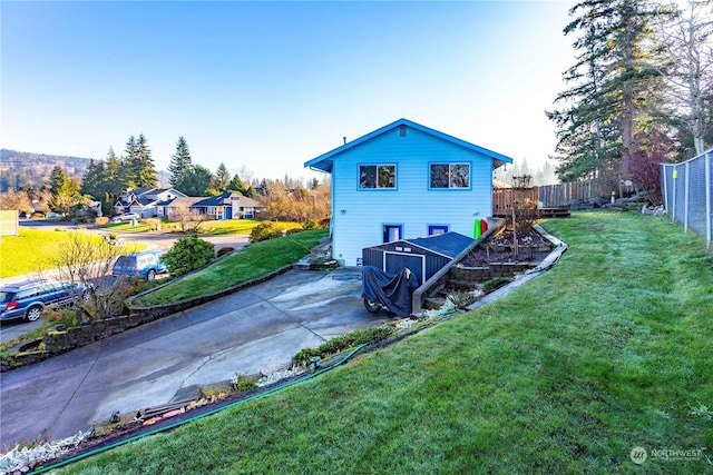 rear view of property with a lawn