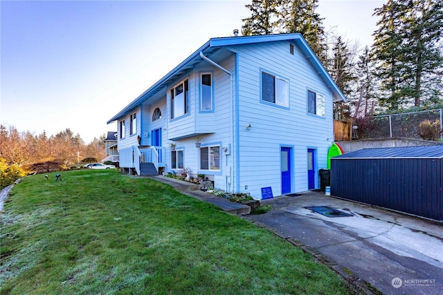 view of property exterior with a lawn