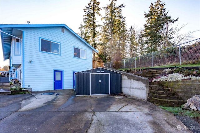 view of home's exterior featuring a shed