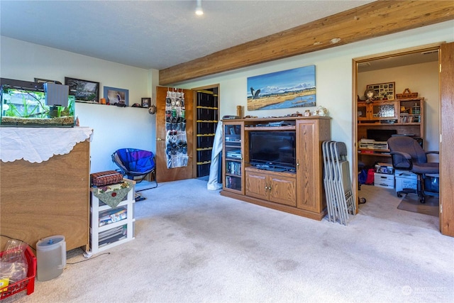 living room with light carpet and beamed ceiling