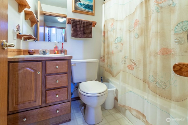 full bathroom featuring vanity, shower / bath combo, and toilet