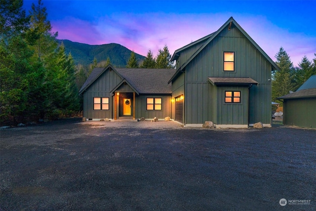 modern inspired farmhouse with a mountain view