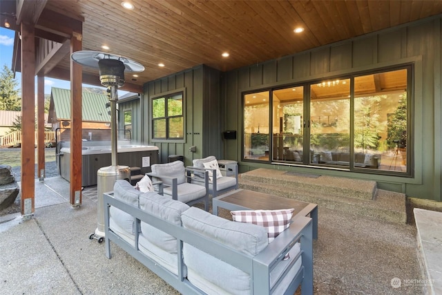 view of patio with an outdoor living space and a hot tub