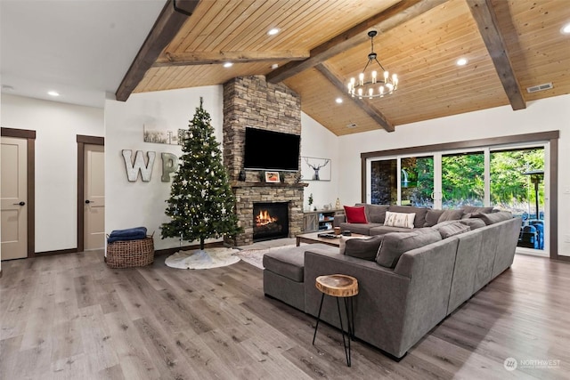 living room with wood ceiling, light hardwood / wood-style floors, and an inviting chandelier