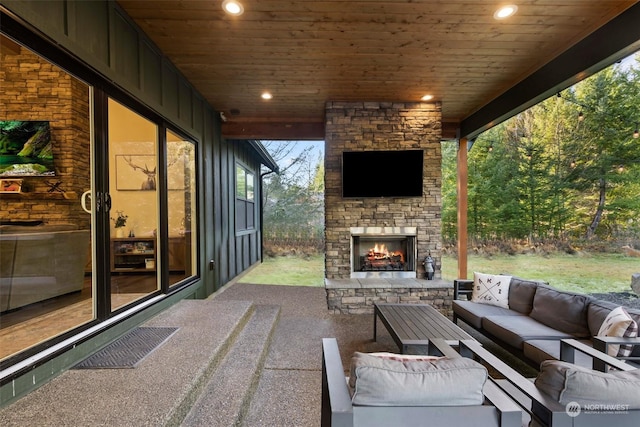 view of patio / terrace with an outdoor living space with a fireplace