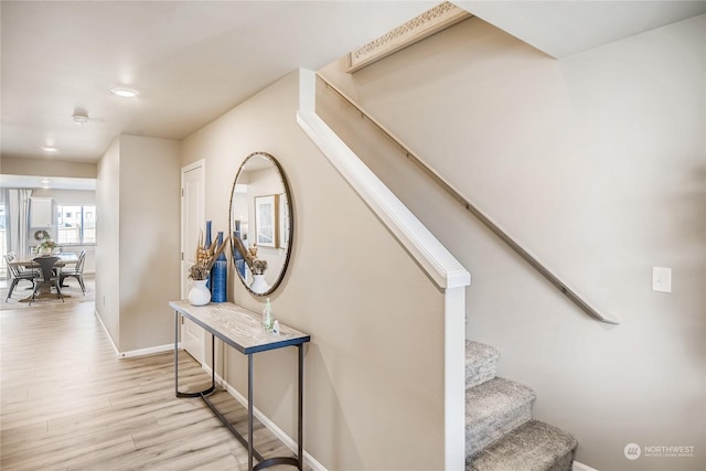 stairway featuring wood-type flooring