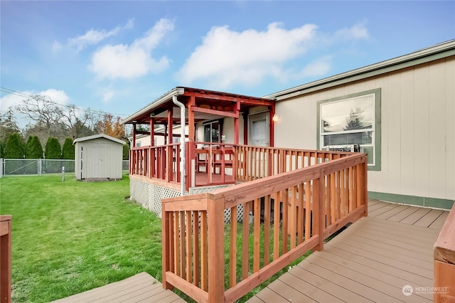 wooden deck featuring a lawn and a storage unit