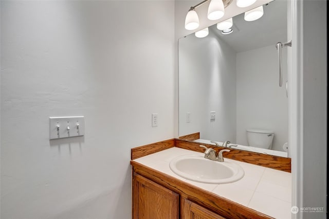 bathroom with vanity and toilet