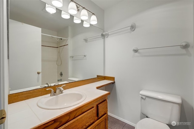 full bathroom with vanity, tile patterned floors, toilet, and shower / bath combination