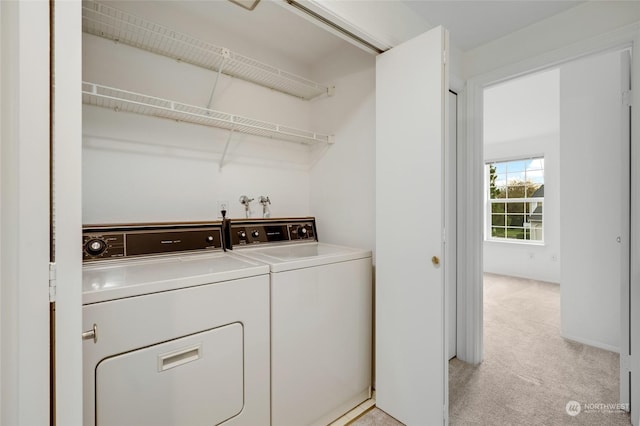 washroom with light carpet and independent washer and dryer