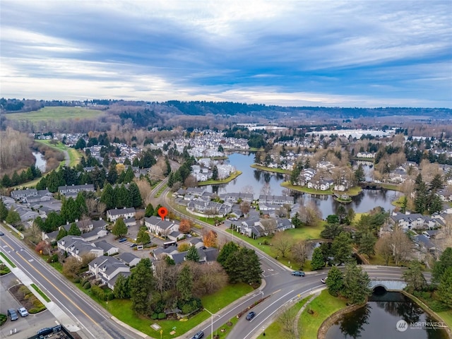 drone / aerial view with a water view