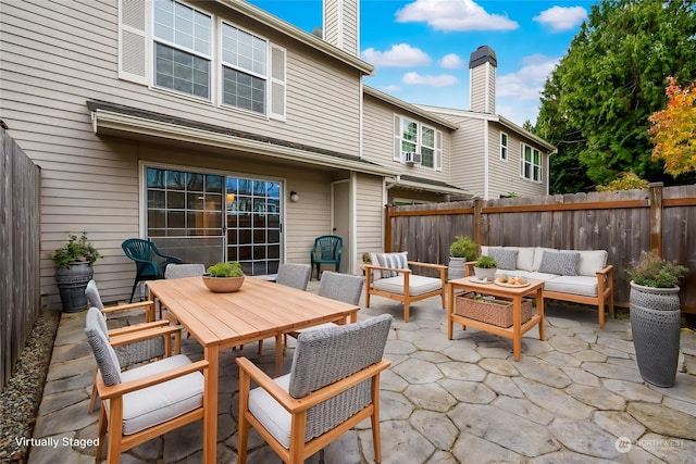 exterior space with cooling unit and an outdoor living space