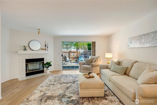 23953 58th Ct S Unit F3, Kent, WA 98032 - living area with wood finished floors and a tiled fireplace