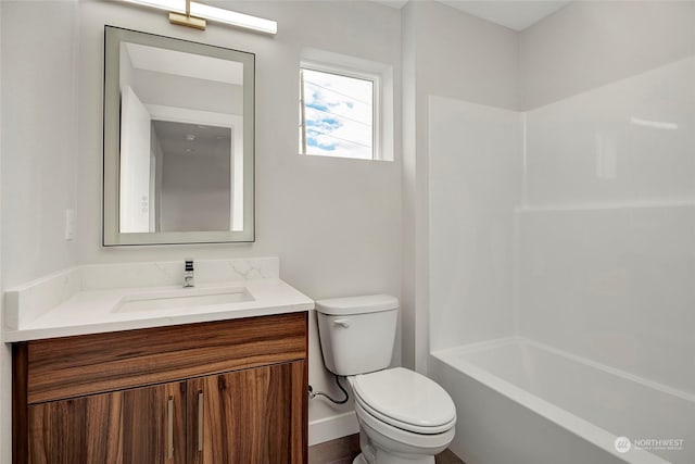 full bathroom with vanity, shower / tub combination, and toilet