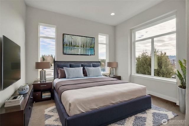 carpeted bedroom with recessed lighting and baseboards