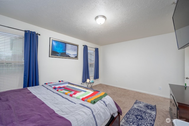 carpeted bedroom with a textured ceiling