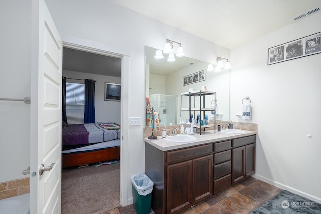 bathroom with vanity and an enclosed shower