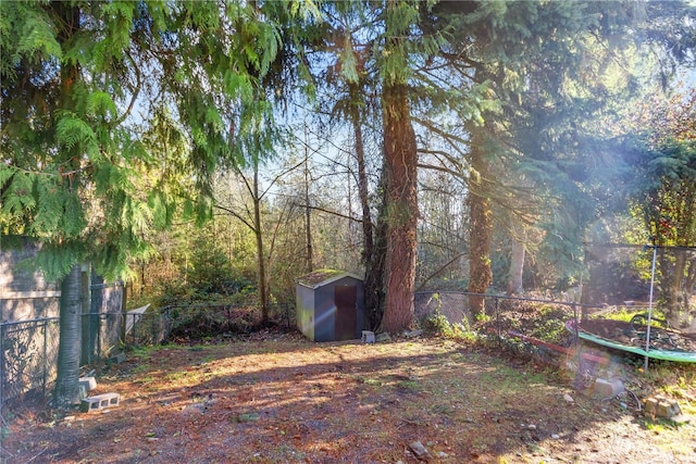 1919 196th St SW Unit 52, Lynnwood, WA 98036 - fenced backyard featuring a shed and a trampoline