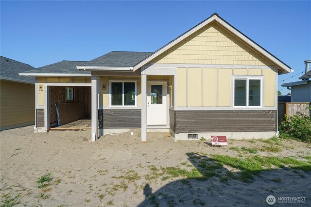 115 7th St SW, Long Beach, WA 98631 - view of front of house with board and batten siding