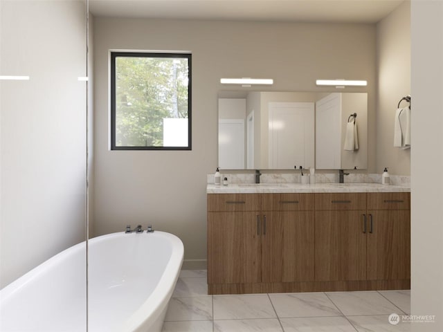 full bathroom with double vanity, a freestanding tub, marble finish floor, and a sink